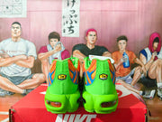 Nike Air Max Plus Sneakers in Orange and Green