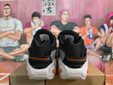 Nike Black Sneakers with Orange Accents