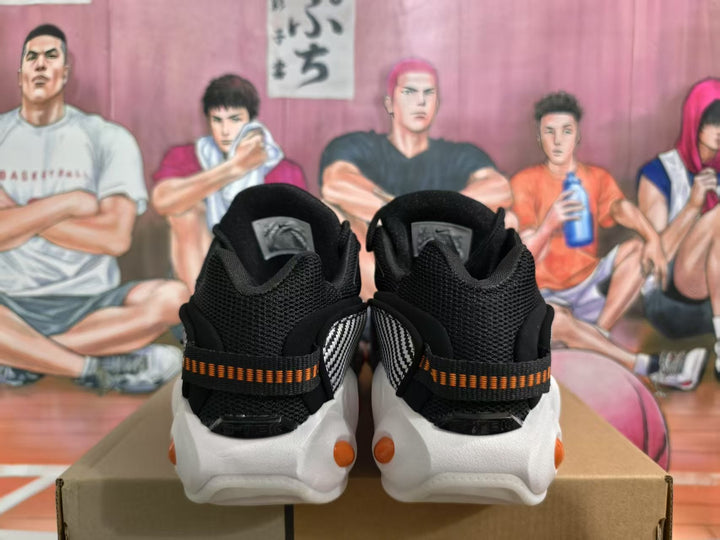 Nike Black Sneakers with Orange Accents