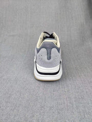 700 Grey Lifestyle Sneakers with Orange Accents