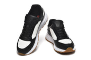 Prada Black and White Logo Low-Top Sneakers