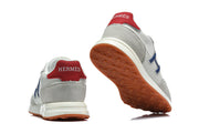 Hermès Grey and White Low-Top Sneakers with Blue Accents